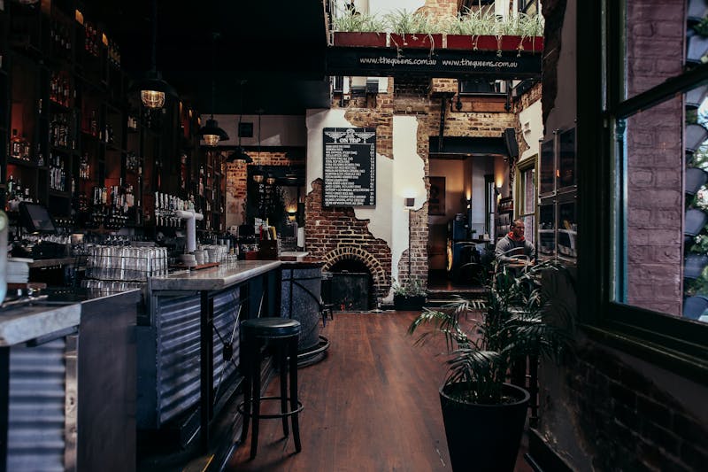 Rustic bar area with warm lighting and brick decor